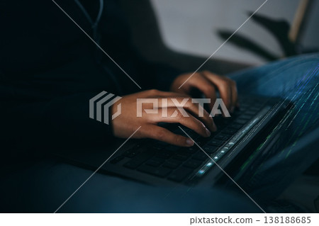 Hacker, hands typing on laptop and information technology for coding and database with phishing and cyber crime. Cybersecurity, person programming or hacking, criminal with ransomware and firewall 138188685