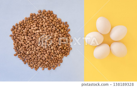 Red cowpeas and organic white chicken eggs on the blue background Red cowpeas and organic white chicken eggs on the blue background 138189328
