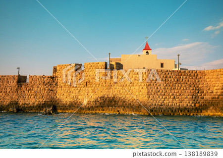 View of the southern sea wall of the Acre city, and the catholic Church of St. John (Saint John the Baptist Church), Acre, Israel View of the southern sea wall of the Acre city, and the catholic Church of St. John (Saint John the Baptist Church), Acre, Israel 138189839