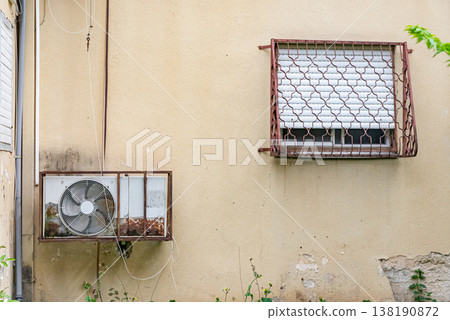 Multiple outdoor air conditioning units installed on exterior wall of residential building. Urban cooling systems and climate control concept. Multiple outdoor air conditioning units installed on exterior wall of residential building. Urban cooling systems and climate control concept. 138190872