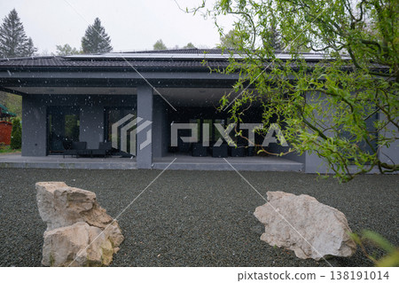 Modular modern smart house exterior in snow with solar roof and unfinished renovation work Modular modern smart house exterior in snow with solar roof and unfinished renovation work 138191014
