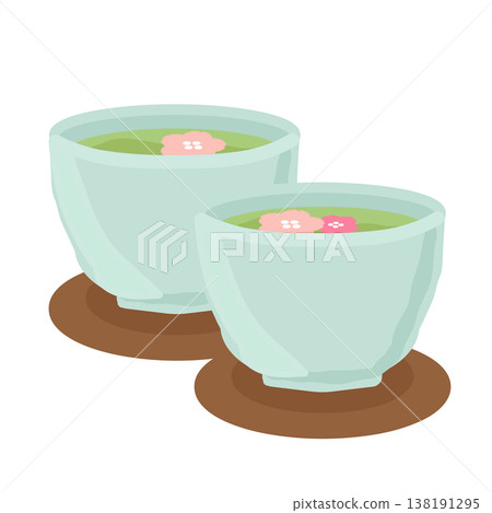 盛在碟子裡的綠茶，碟子上裝飾著一朵漂浮的櫻花（插圖） 138191295