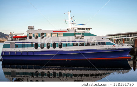 A modern passenger ferry with blue and white hull A modern passenger ferry with blue and white hull 138191780