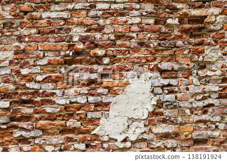 Uneven old red brick wall Uneven old red brick wall 138191924