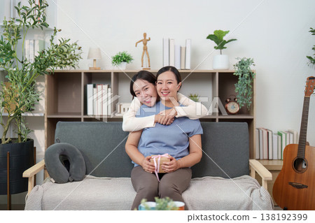 Mother and daughter embracing with love and gratitude Mother and daughter embracing with love and gratitude 138192399