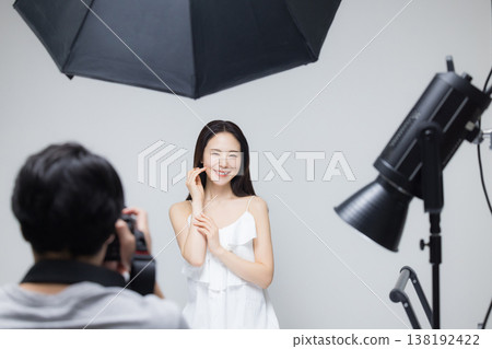 Woman watching camera Woman watching camera 138192422