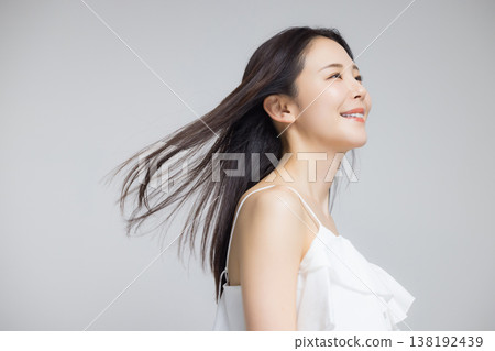 young woman with frizzy hair young woman with frizzy hair 138192439