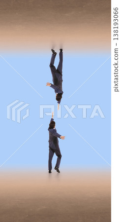 Businessman falling downward while reaching toward another hand in abstract space 138193066