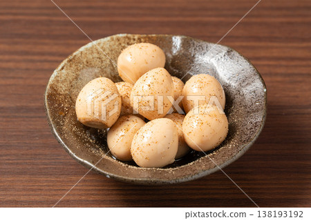 Quail eggs marinated in soy sauce: A popular snack with a rich, savory flavor. Quail eggs marinated in soy sauce: A popular snack with a rich, savory flavor. 138193192