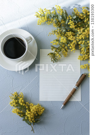A spring table photo featuring mimosa, coffee, and a notepad. Copy space available. 138193300