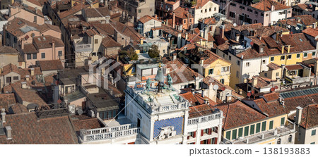 Historic bell tower rising above Venetian rooftops Historic bell tower rising above Venetian rooftops 138193883