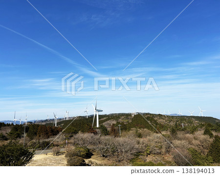 Windmill shines in the blue sky 138194013