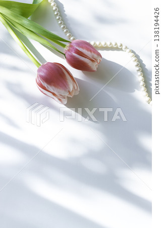 Spring table photo featuring tulips and a pearl necklace (copy space available) Spring table photo featuring tulips and a pearl necklace (copy space available) 138194426