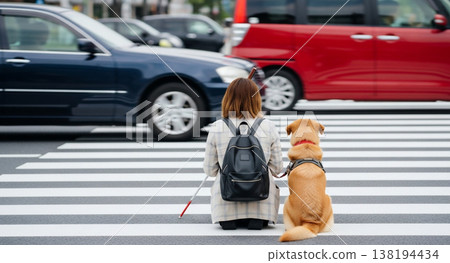 Visually impaired and guide dog Visually impaired and guide dog 138194434