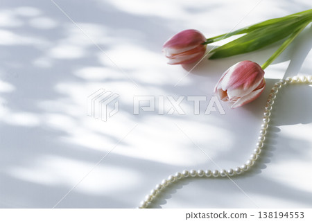 Spring table photo with tulips and pearl necklace (copy space) 138194553