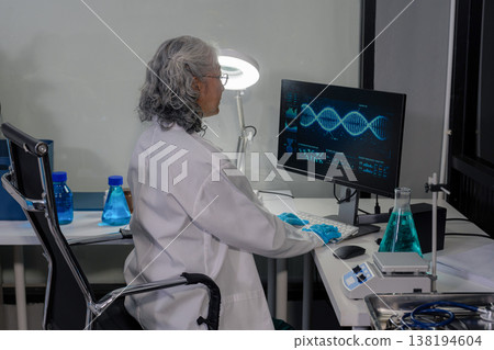 Medical Research Laboratory: Two scientists working, using digital tablets, analyzing samples, talking, developing biotechnology. Medical Research Laboratory: Two scientists working, using digital tablets, analyzing samples, talking, developing biotechnology. 138194604