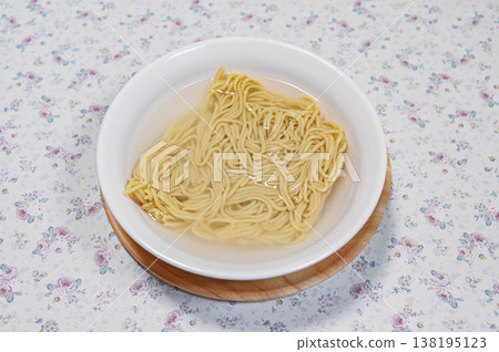 Chinese noodles in hot water (before microwaving) Chinese noodles in hot water (before microwaving) 138195123