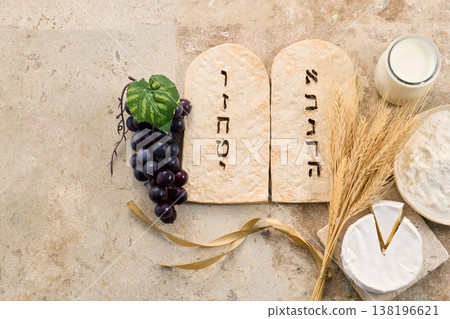 Shavuot ten commandments with traditional dairy and grain foods 138196621