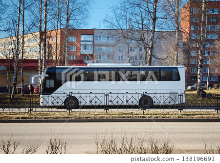 Bus parked on the street near residential buildings on a sunny day Bus parked on the street near residential buildings on a sunny day 138196691