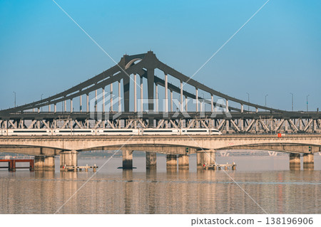 High speed train travels across Qiantang River bridge in Hangzhou. High speed train travels across Qiantang River bridge in Hangzhou. 138196906