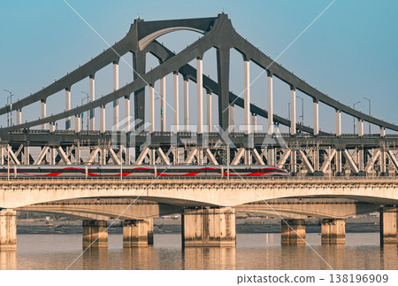 High speed train travels across Qiantang River bridge in Hangzhou. High speed train travels across Qiantang River bridge in Hangzhou. 138196909