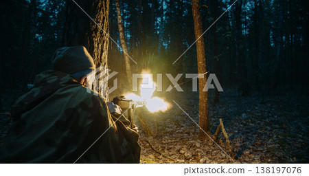 Red army soviet russian soldier soldier firing machine gun with large muzzle flash in night battle 138197076