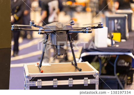 Professional multirotor drone with camera system at exhibition 138197334