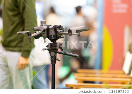 Surveying drone mounted on tripod at exhibition Surveying drone mounted on tripod at exhibition 138197353