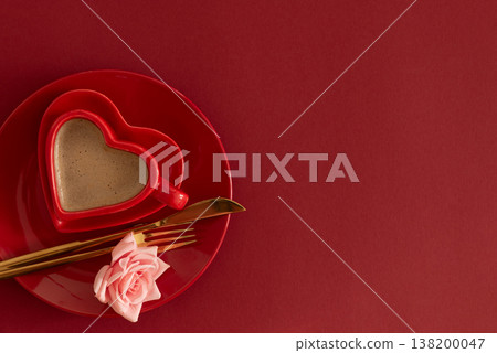 Heart Shaped Coffee Cup with Rose on red background 138200047
