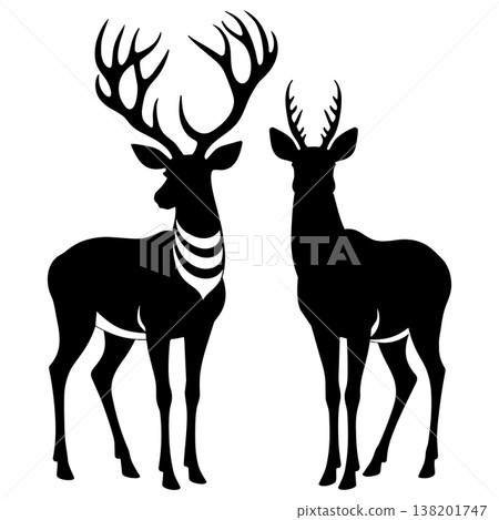 Two stags in silhouette one with large antlers and striped neck facing viewer 138201747