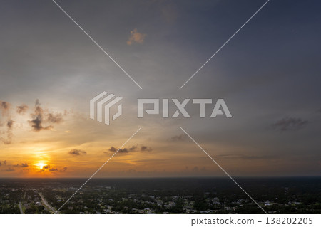 Evening sunset sky with colorful clouds over dark land. Panoramic skyscape Evening sunset sky with colorful clouds over dark land. Panoramic skyscape 138202205