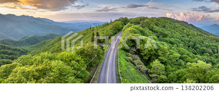 Evening mountain landscape of forest road in North Carolina Appalachians, USA. Blue Ridge Parkway American highway in summer season Evening mountain landscape of forest road in North Carolina Appalachians, USA. Blue Ridge Parkway American highway in summer season 138202206