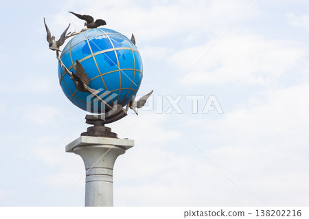 Earth globe with doves around it Earth globe with doves around it 138202216