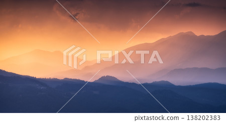 Amazing silhouettes of a mountains at colorful sunset in summer 138202383