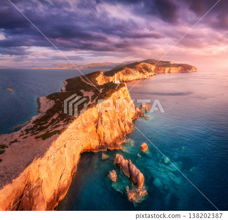 Lighthouse on the mountain peak at colorful sunset in summer 138202387