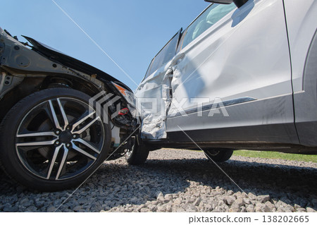 Cars crashed heavily in road accident after collision on city street. Road safety and insurance concept Cars crashed heavily in road accident after collision on city street. Road safety and insurance concept 138202665