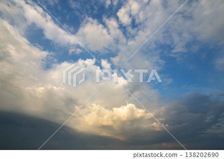 Blue sky covered with white puffy clouds. 138202690
