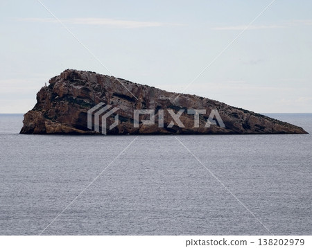 Angled cliff face extending from sea acts as visual warning for sailors and safety observers Angled cliff face extending from sea acts as visual warning for sailors and safety observers 138202979