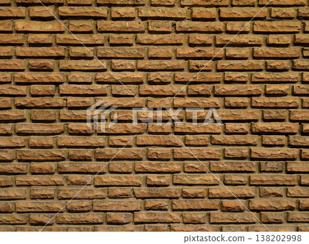 Distinct weathered terracotta bricks featuring pronounced joint lines and warm subtle shadows for design use Distinct weathered terracotta bricks featuring pronounced joint lines and warm subtle shadows for design use 138202998