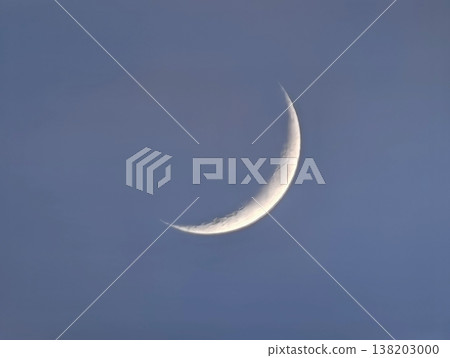 Serene crescent under dusk light, Calm celestial sliver resting in tranquil twilight surroundings Serene crescent under dusk light, Calm celestial sliver resting in tranquil twilight surroundings 138203000