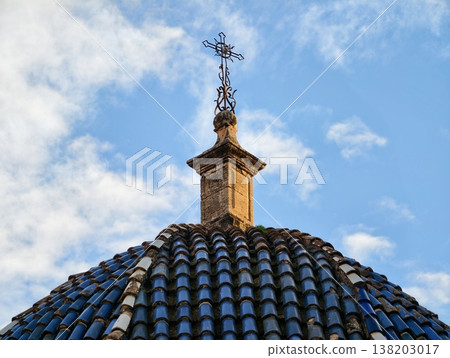 Dome with cross, Peaceful sunrise landscape showcasing church dome with cross and vibrant clouded sky Dome with cross, Peaceful sunrise landscape showcasing church dome with cross and vibrant clouded sky 138203017