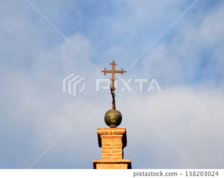 Sacred tower sunrise, Spiritual monument with decorative orb and slender pinnacle shining during dawn Sacred tower sunrise, Spiritual monument with decorative orb and slender pinnacle shining during dawn 138203024