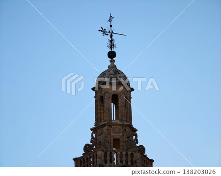 Architectural view of historic bell tower with spire set against clean blue sky background Architectural view of historic bell tower with spire set against clean blue sky background 138203026