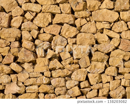 Warm textured stones, Detailed view of aged masonry showcasing craftsmanship and natural hues Warm textured stones, Detailed view of aged masonry showcasing craftsmanship and natural hues 138203082