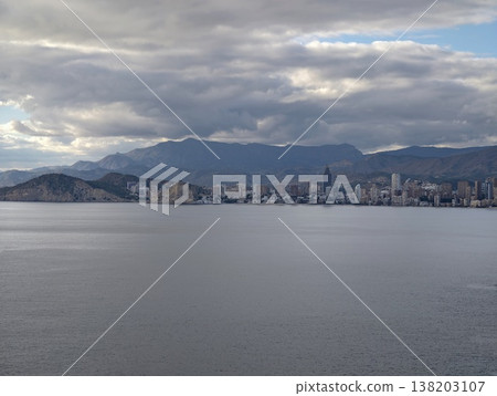 Spacious seaside landscape showcasing faroff metropolis and peaceful water surfaces for artistic backgrounds Spacious seaside landscape showcasing faroff metropolis and peaceful water surfaces for artistic backgrounds 138203107