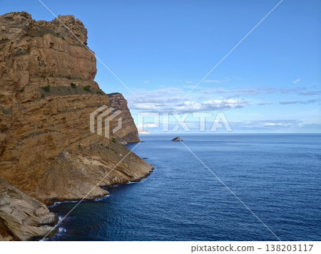 Serene coastal vista, Tranquil seascape highlighting textured geological formations and soft clouds Serene coastal vista, Tranquil seascape highlighting textured geological formations and soft clouds 138203117