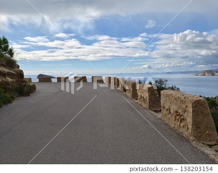 Bay and hillside panoramic view, Picturesque vantage point overlooking seaside town and steep cliffs Bay and hillside panoramic view, Picturesque vantage point overlooking seaside town and steep cliffs 138203154