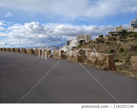 Scenic property situated on hillside overlooking bay, Cluster of houses on hill with sea view background Scenic property situated on hillside overlooking bay, Cluster of houses on hill with sea view background 138203156
