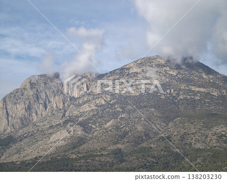 Mountain geology scenery, Natural mountain slopes with detailed strata and misty atmospheric ambiance Mountain geology scenery, Natural mountain slopes with detailed strata and misty atmospheric ambiance 138203230