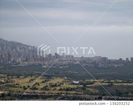 Distant coastal urban environment featuring lush landscapes and layered skyline background Distant coastal urban environment featuring lush landscapes and layered skyline background 138203252
